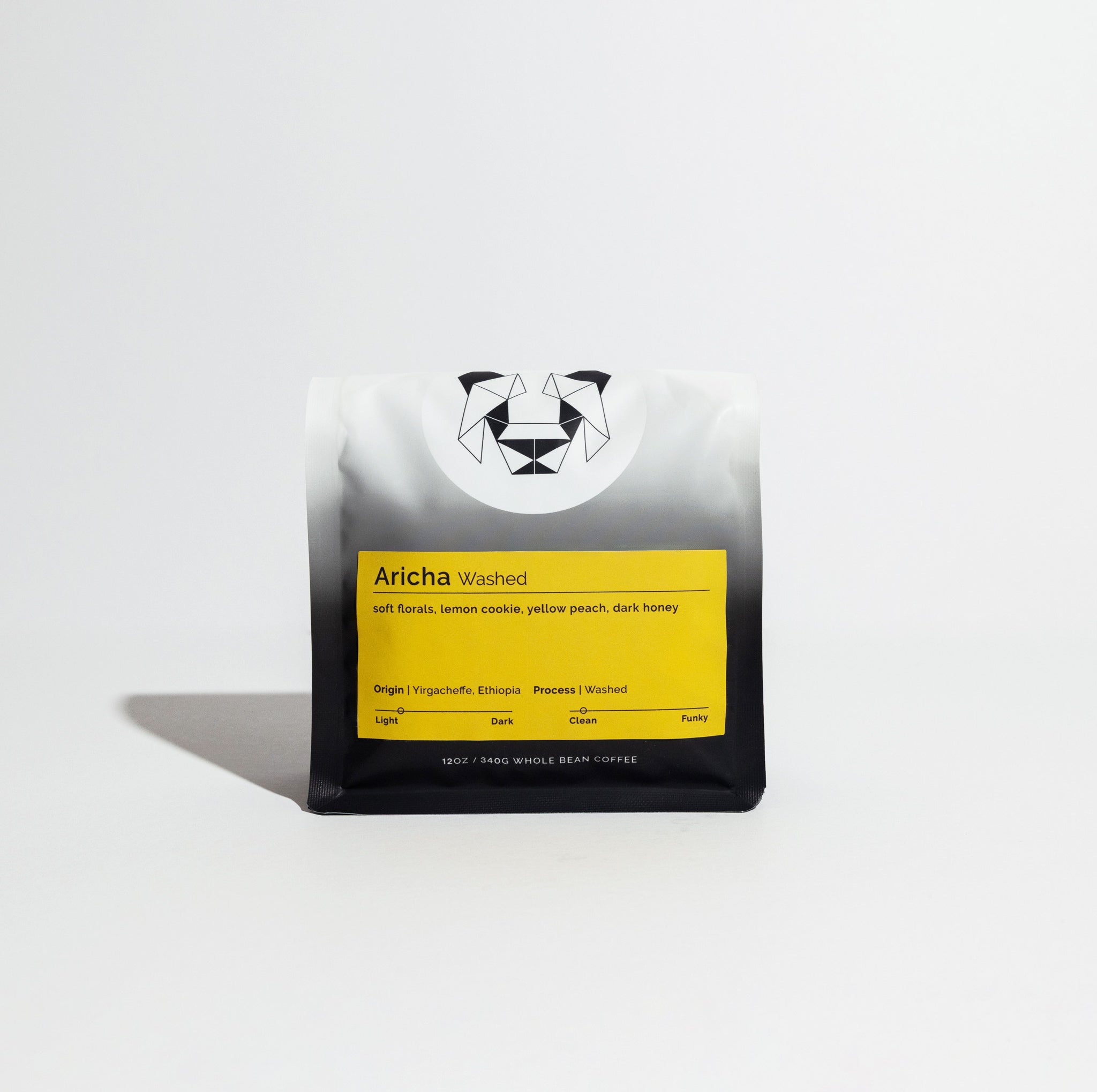 Aricha Washed coffee bag with yellow label displaying tasting notes: soft florals, lemon cookie, yellow peach, dark honey, from Yirgacheffe, Ethiopia, 12 oz whole beans.