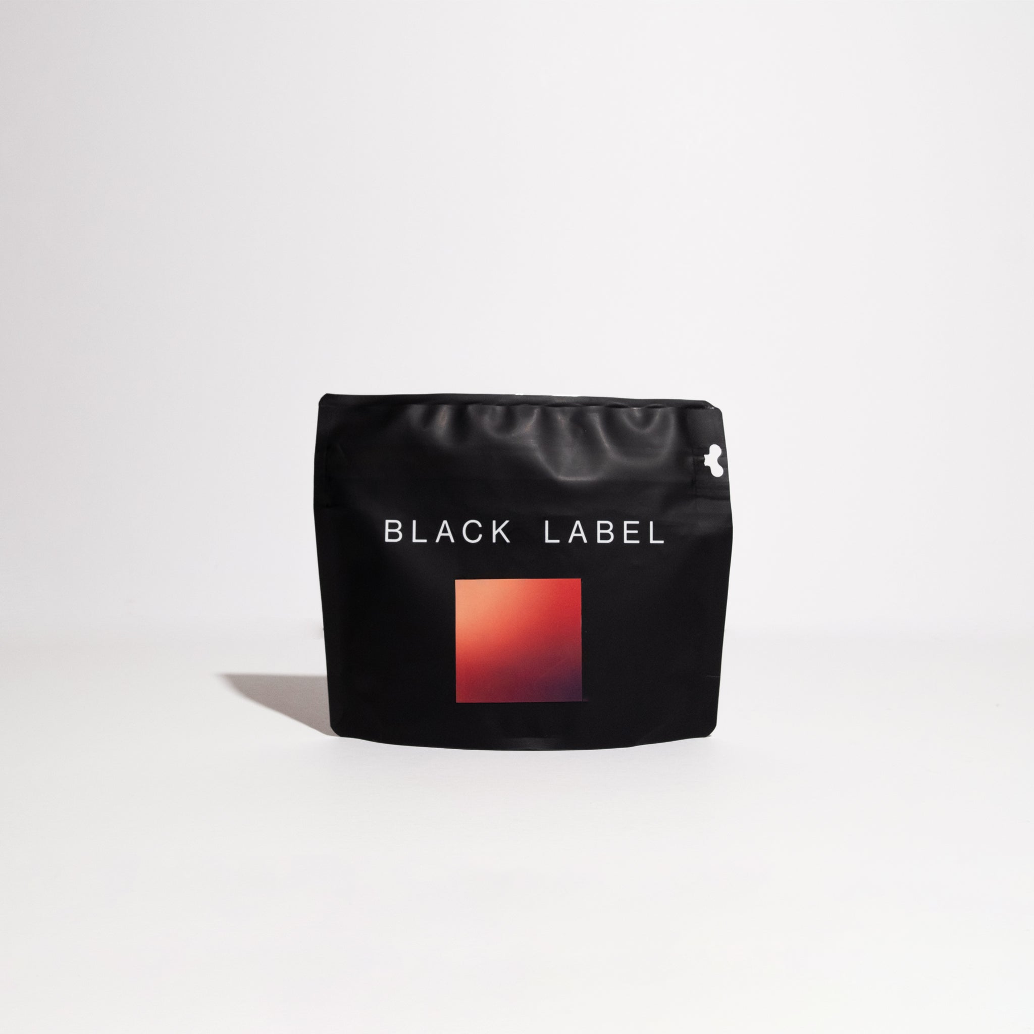 Nestor Lasso - Ombligon Natural coffee bag with a red square label, highlighting its specialty coffee origins and unique fermentation process.