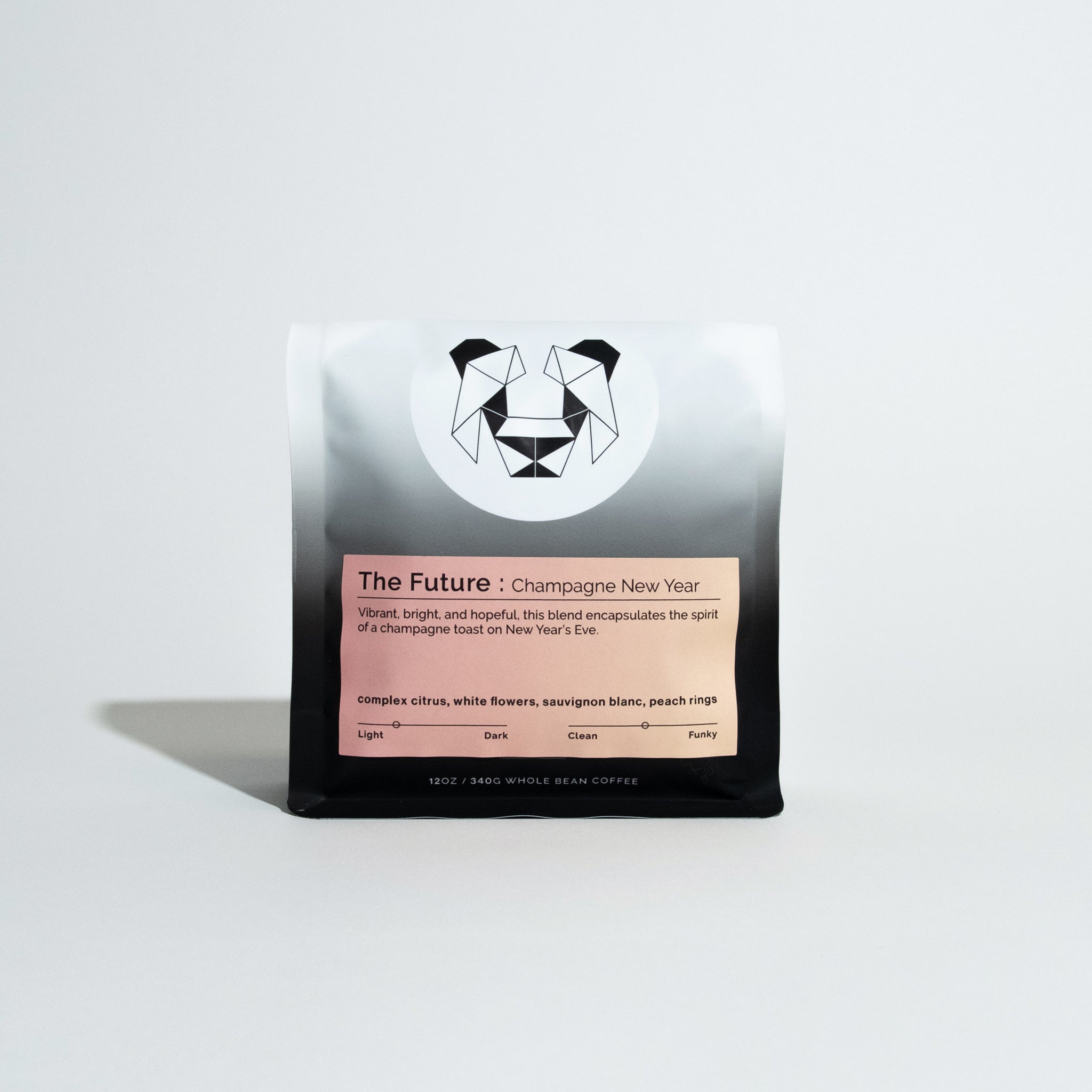 Stand-up coffee bag with geometric animal logo, labeled “The Future: Champagne New Year,” featuring tasting notes and roast level guide, 12oz whole bean.