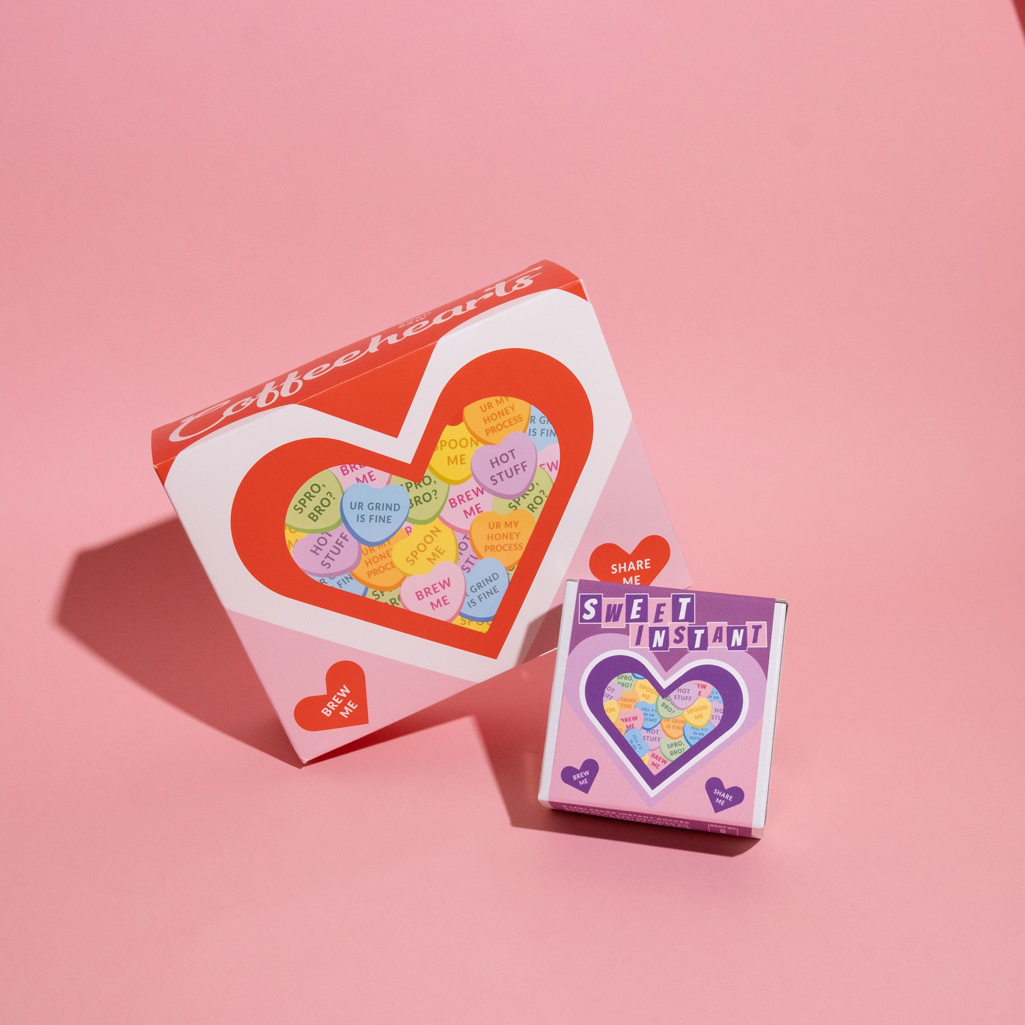 Coffee is for Lovers Bundle: Two heart-shaped boxes reveal coffee-themed candy hearts with playful puns, perfect for gifting or self-indulgence.