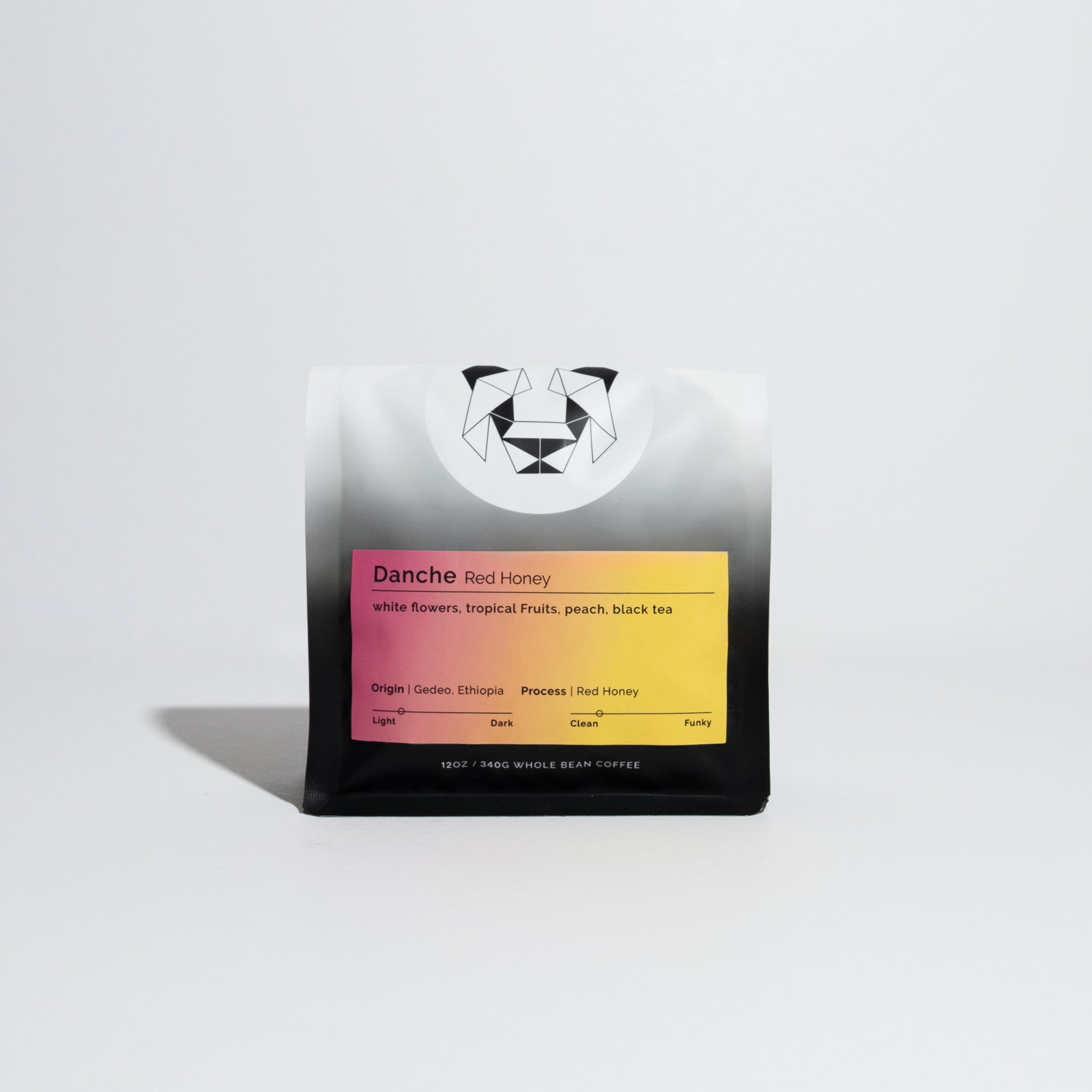 Standing pouch of Danche - Red Honey whole-bean coffee from Gedeo, Ethiopia, featuring tasting notes of white flowers, tropical fruits, peach, and black tea.