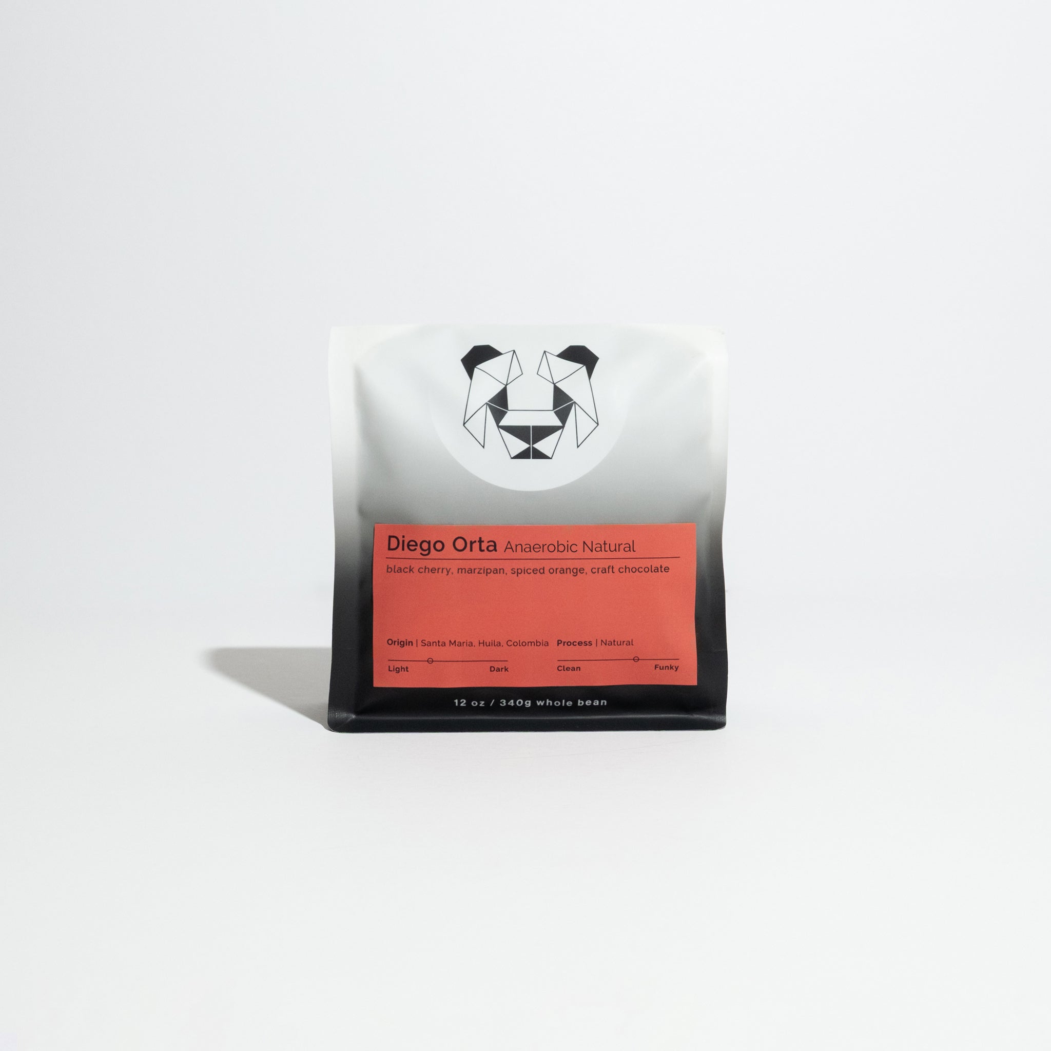 Bag of Diego Orta Anaerobic Natural coffee, whole-bean, 12 oz, featuring tasting notes of black cherry, marzipan, spiced orange, and craft chocolate.