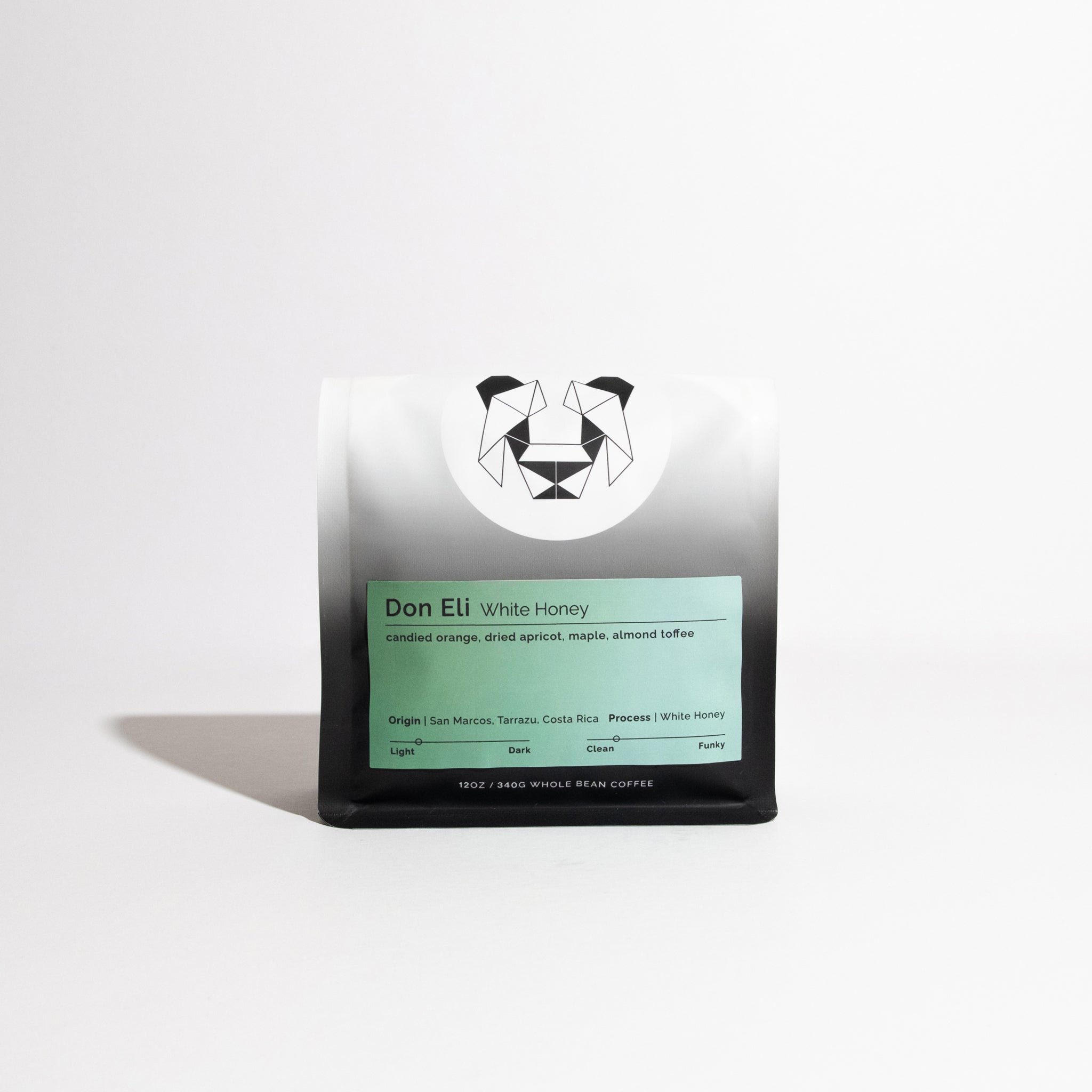 Don Eli White Honey coffee bag, featuring tasting notes of candied orange and almond toffee, from San Marcos, Costa Rica, with a geometric logo.