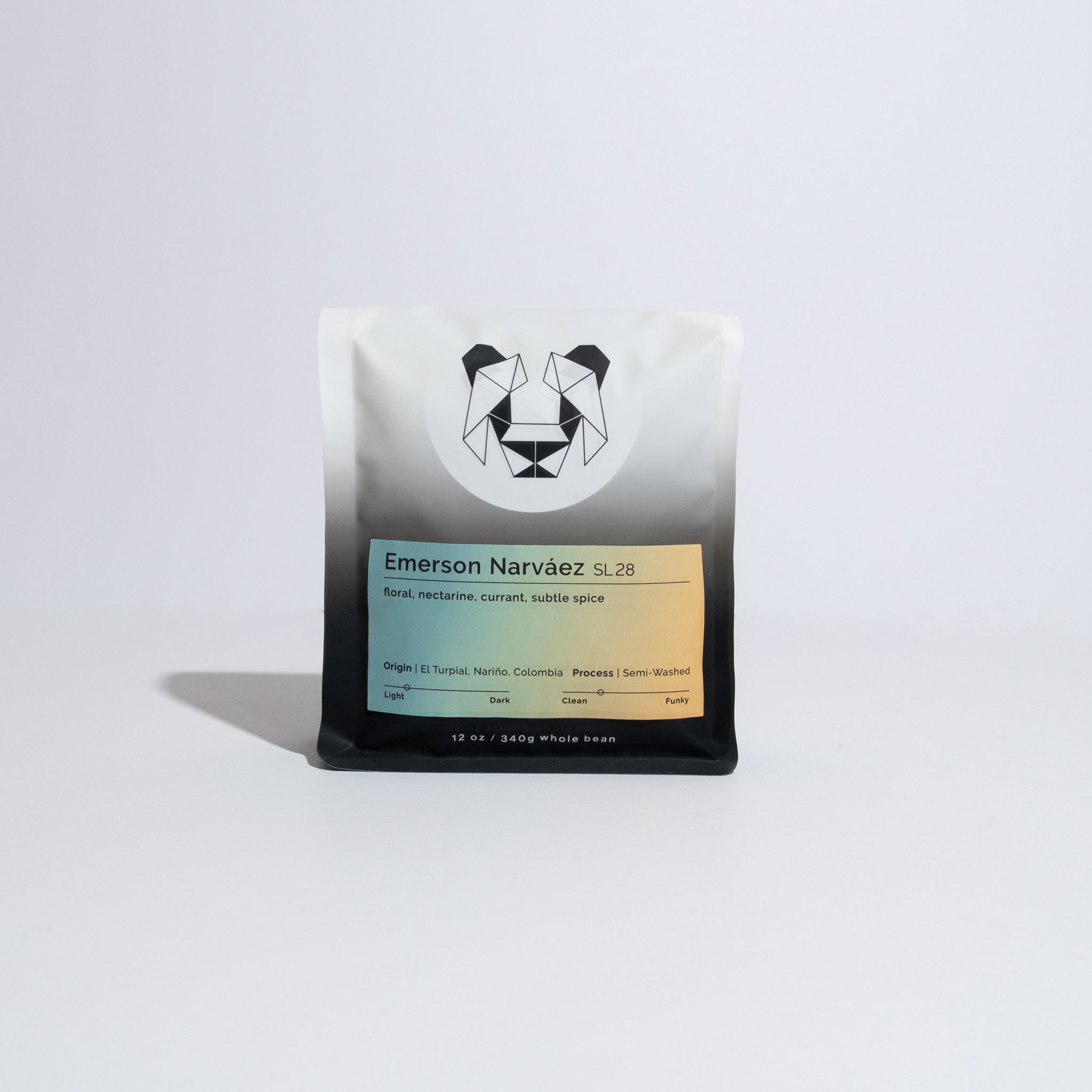 Sealed pouch of specialty coffee beans, Emerson Narváez SL 28, showcasing geometric animal logo, rainbow label with tasting notes, origin, process, and weight details.