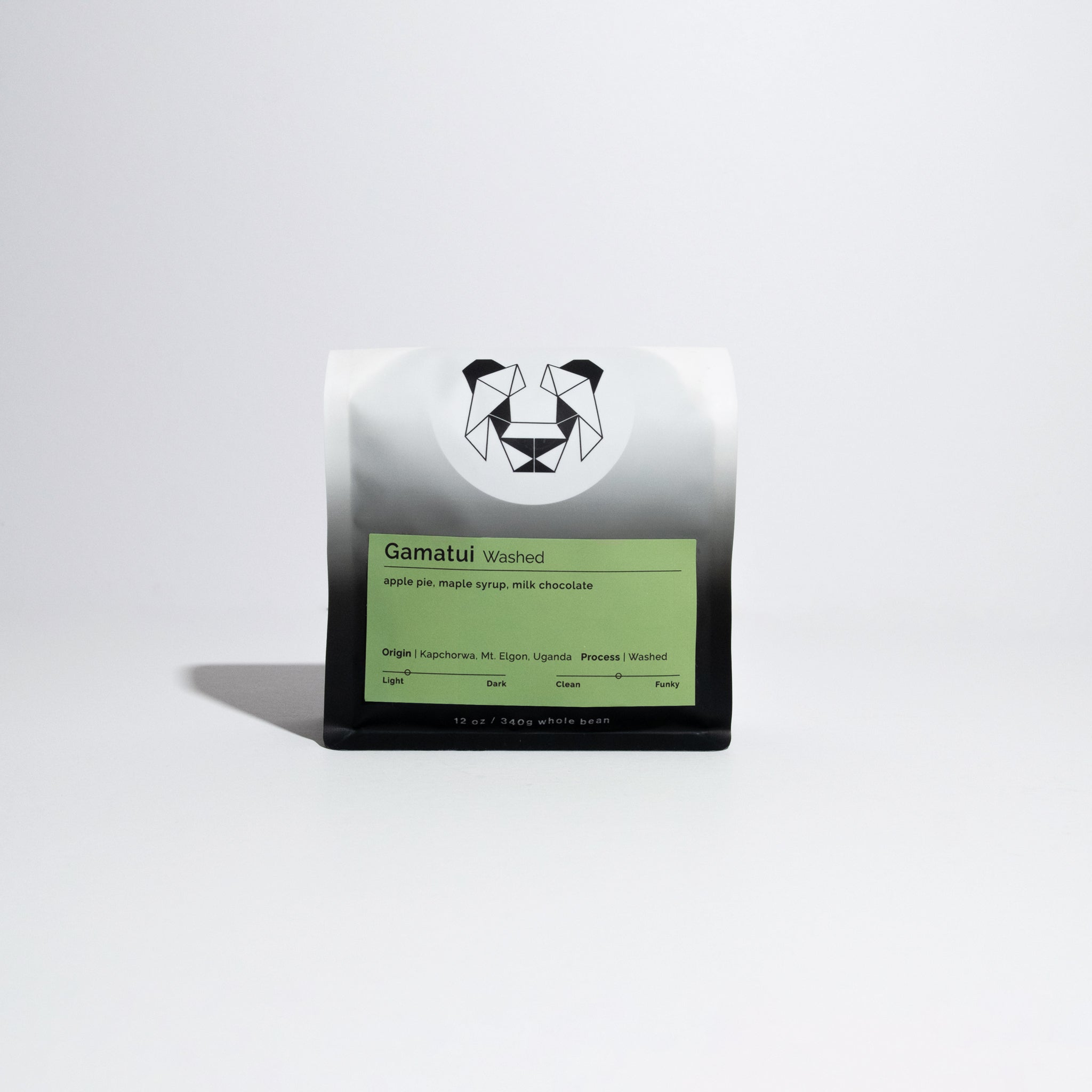 Close-up of Gamatui - Washed coffee bag with logo of a panda, highlighting partnership with Gamatui Community, Uganda, emphasizing high-quality, traditionally processed coffee.