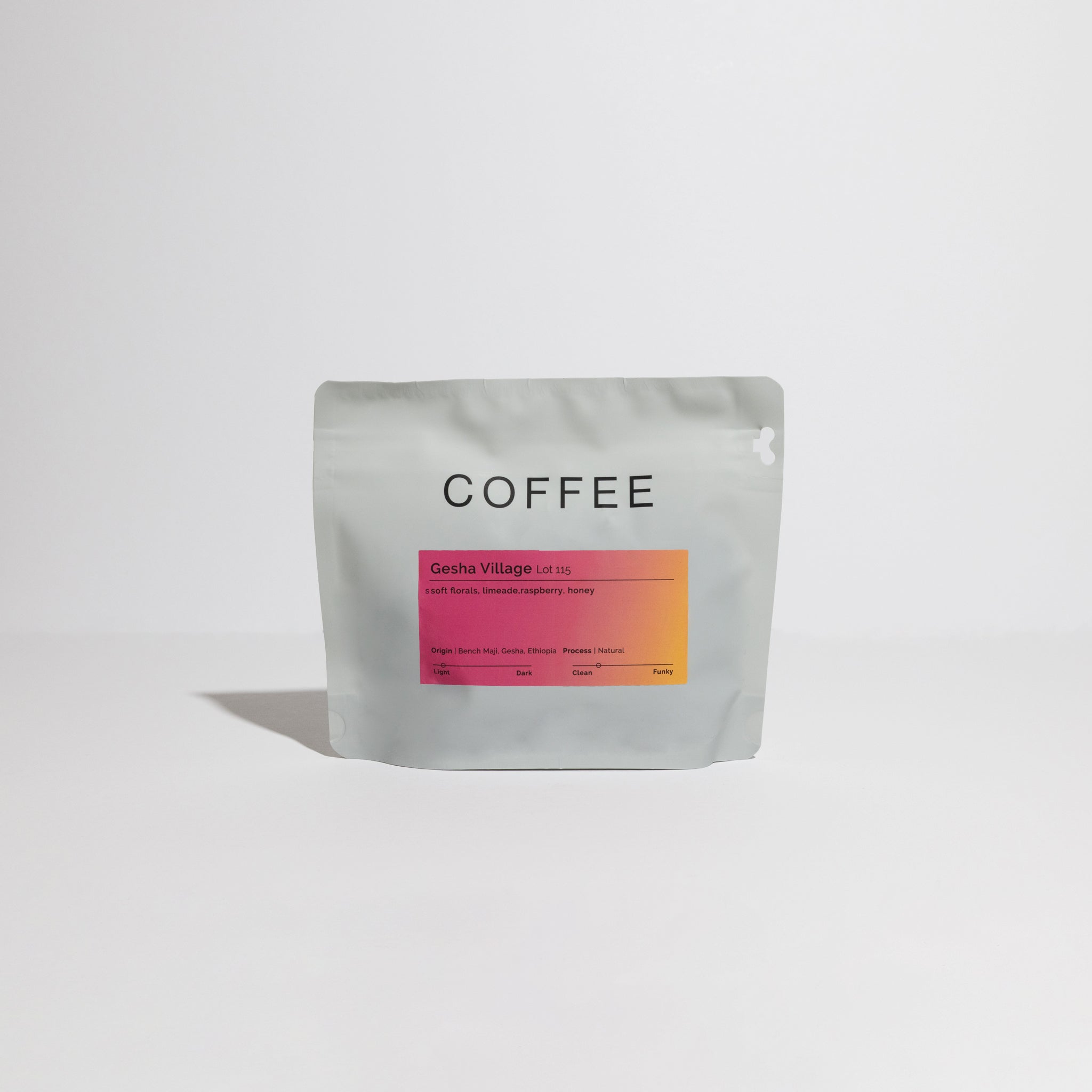 Gesha Village - Lot 115 coffee beans, renowned for their floral and sweet notes, displayed in a package highlighting their origin from Ethiopia's Gesha Village Estate.