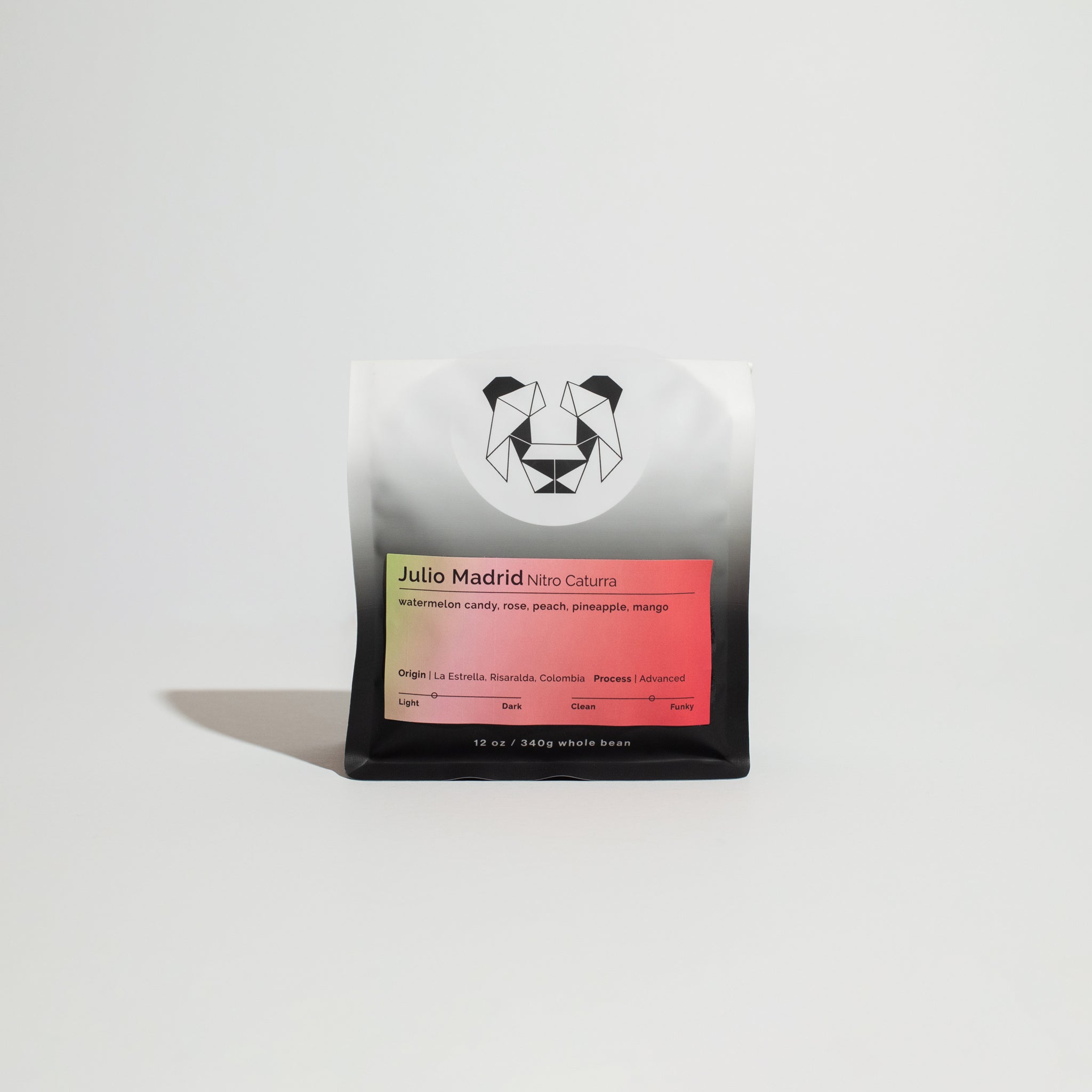 Julio Madrid - Nitro Caturra coffee beans, showcasing advanced anaerobic fermentation techniques, emphasizing unique flavor profiles like fruity notes of peach, pineapple, and mango.