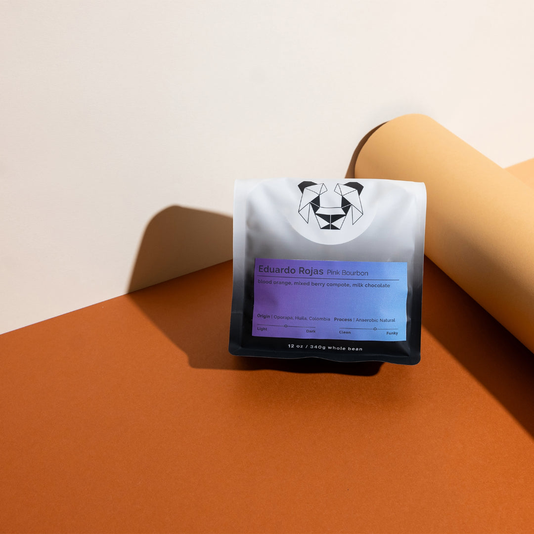 Eduardo Rojas - Pink Bourbon coffee bag showcasing origin, process, and tasting notes, highlighting its unique anaerobic natural fermentation and mixed berry compote flavor profile.
