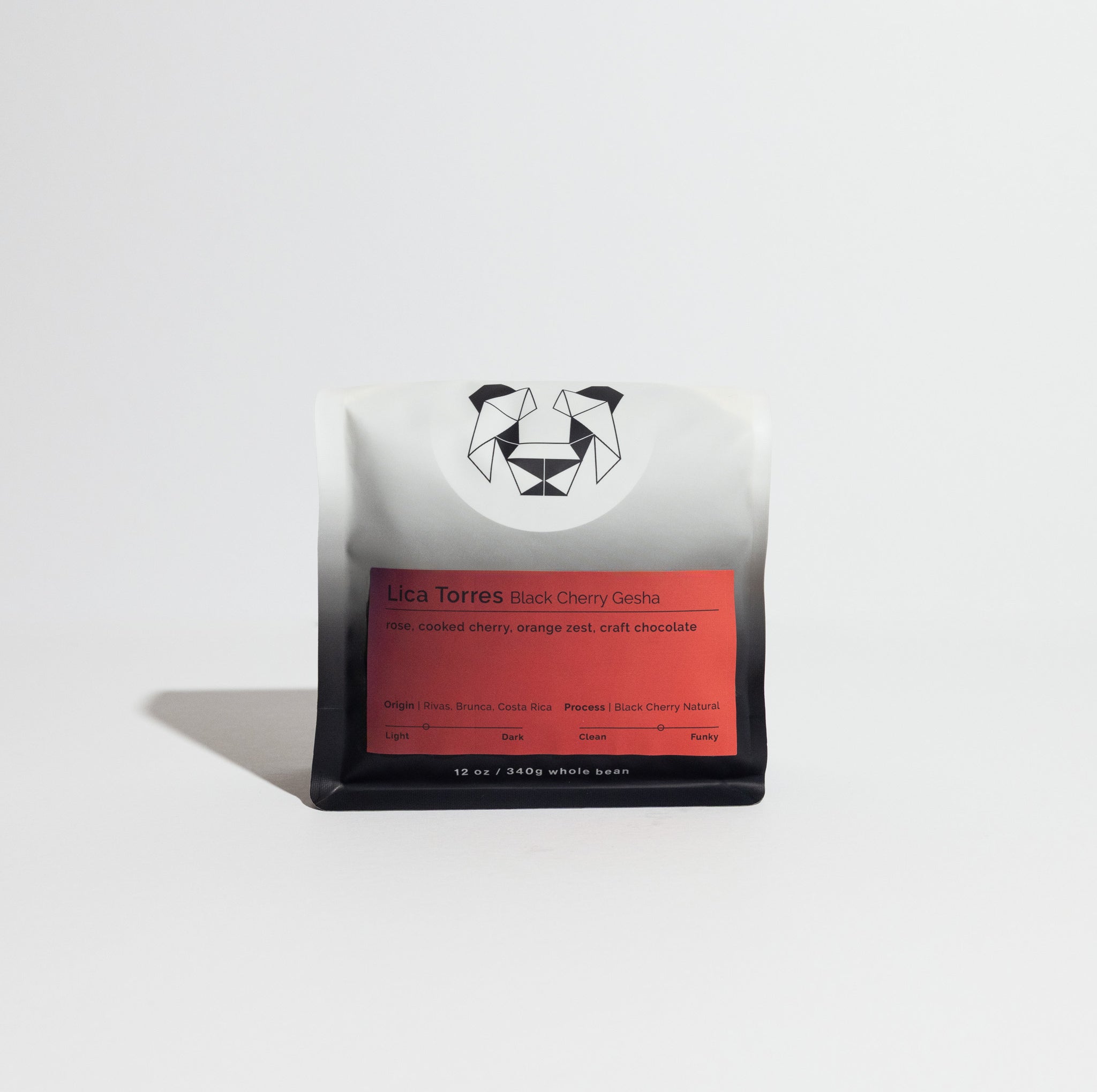 Lica Torres Black Cherry Gesha coffee, 12 oz bag, features a black-and-white pouch with geometric logo, red label detailing tasting notes and Costa Rican origin.