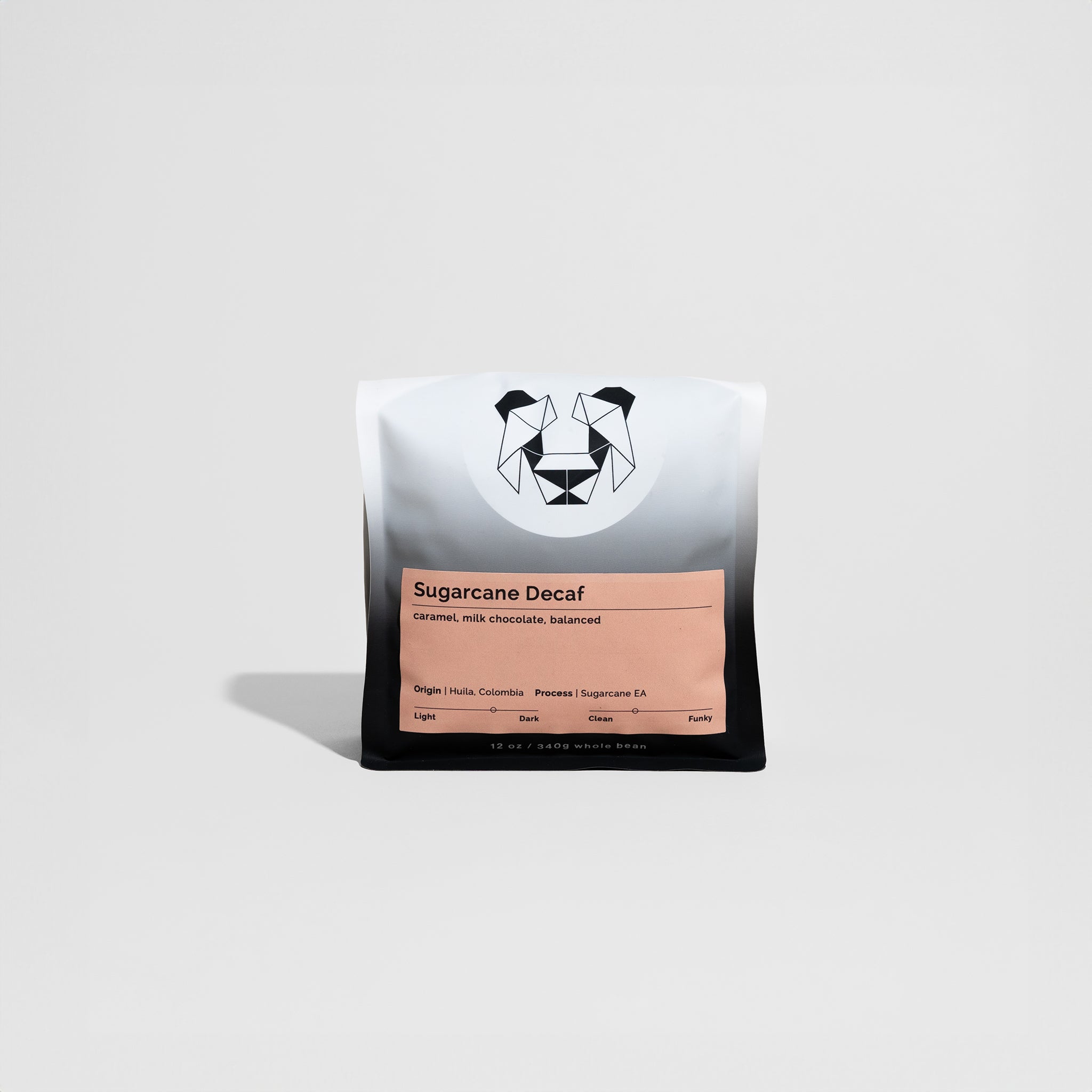 Sugarcane Decaf coffee beans from Hulia, Colombia, highlighting medium-dark roast with caramel and milk chocolate notes, processed using the Sugarcane Decaffeination method.