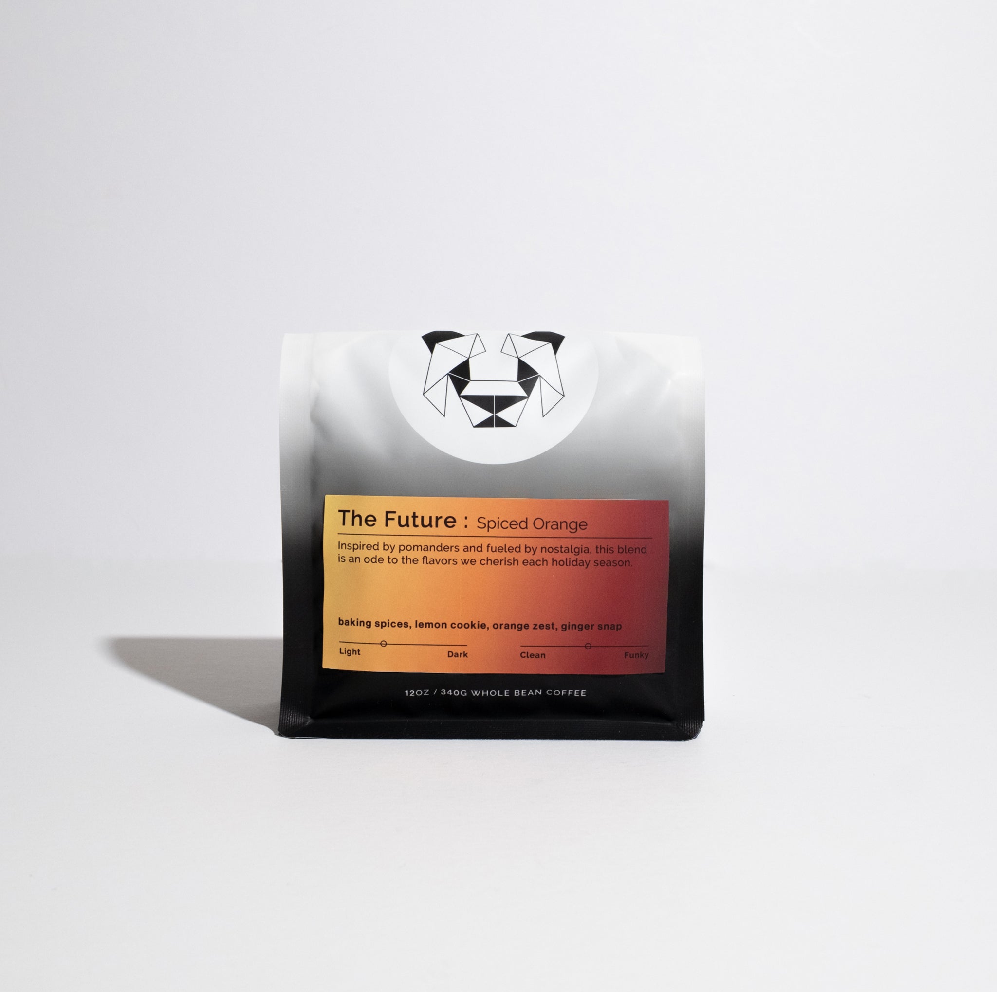 Bag of whole-bean coffee labeled “The Future: Spiced Orange,” featuring tasting notes like baking spices and orange zest, 12 oz with geometric-logo design.