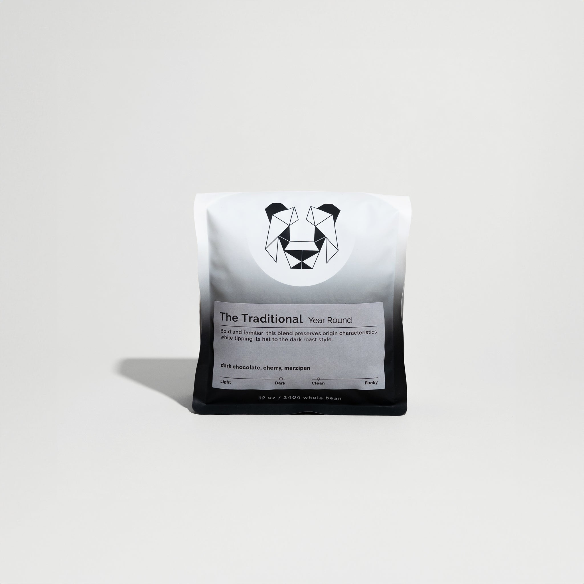 The Traditional coffee package, labeled as a dark roast from Ethiopia, featuring notes of dark chocolate, cherry, and marzipan, sits on display.