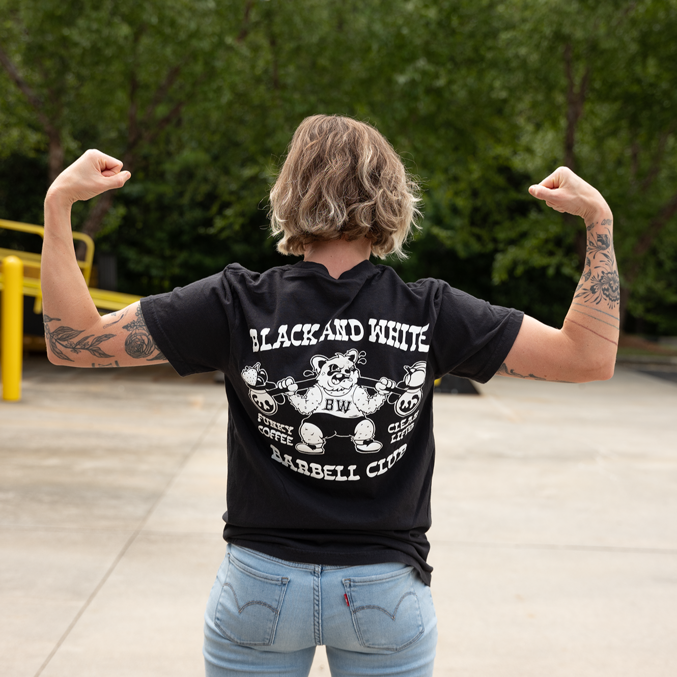 B&W Barbell Club Shirt with heavyweight cotton, featuring co-fermented coffee design on front and artwork by @ghosttown.atl on back, perfect for gym enthusiasts.