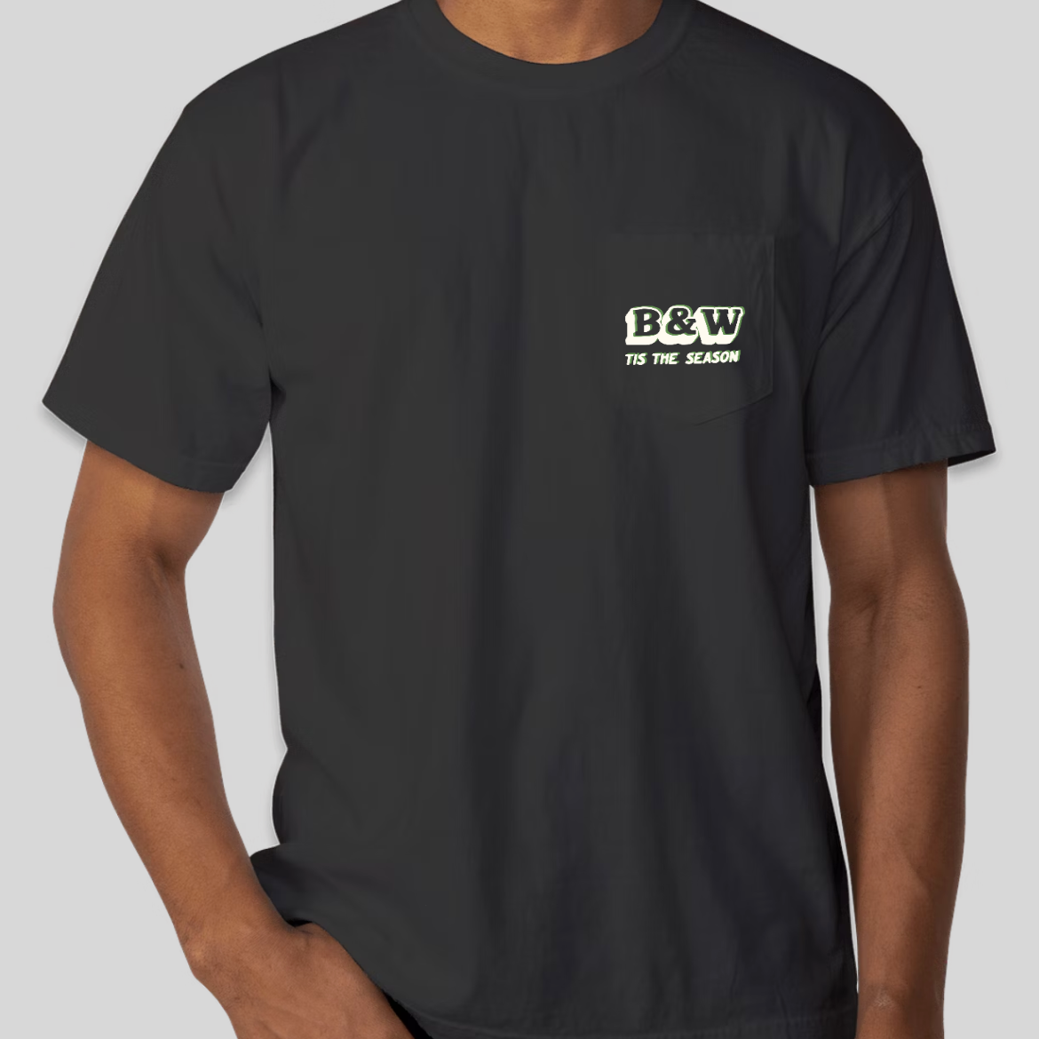 Holiday Glitch Shirt with trippy green and white design on a Comfort Colors pocket tee, featuring a relaxed fit and durable stitching.