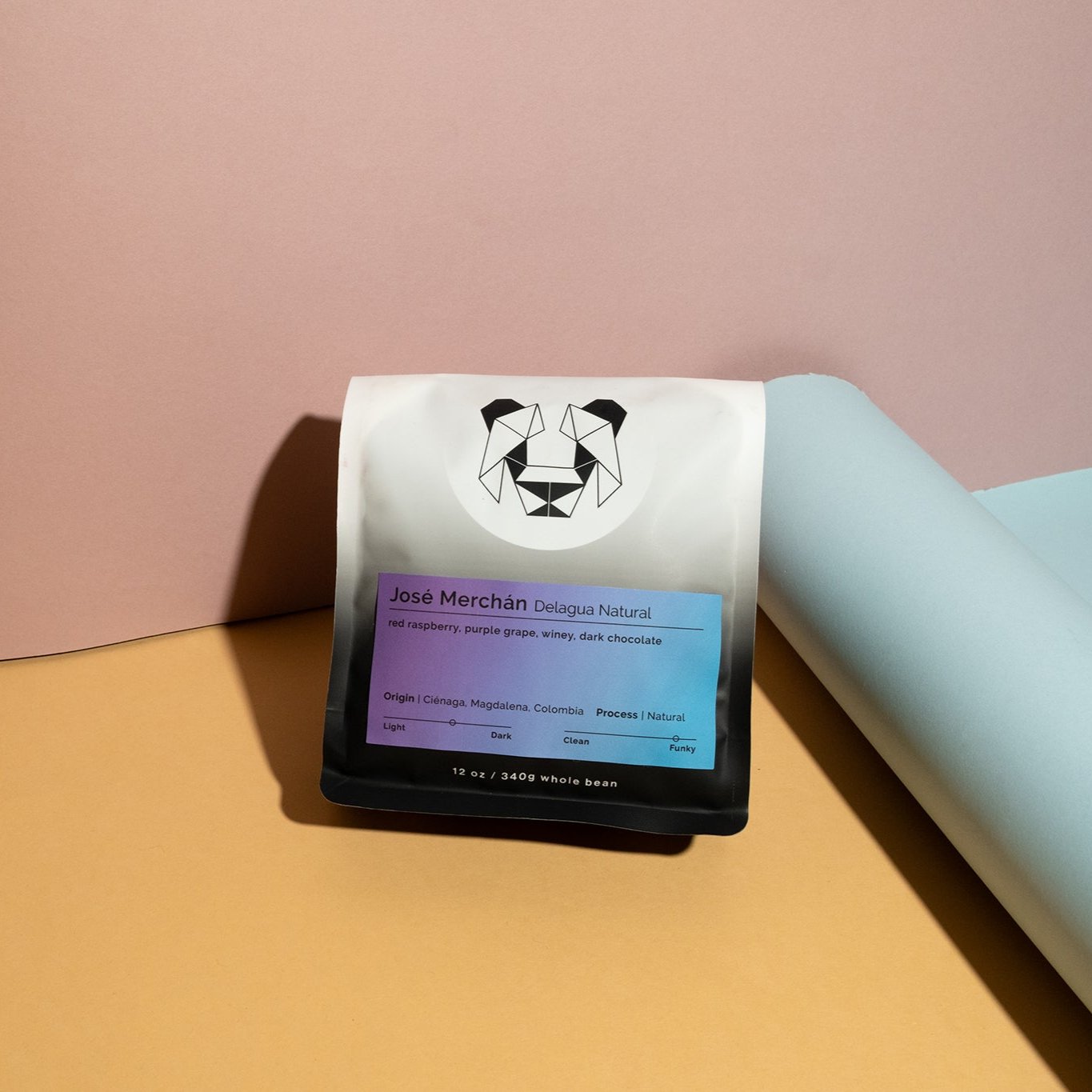 José Merchán - Delagua Natural coffee pack, showcasing its origin from Cienaga, Colombia, highlighting its natural processing and rich, dark fruit flavor profile.