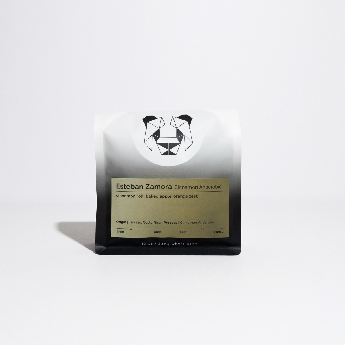 A single bag of Esteban Zamora Cinnamon Anaerobic whole bean coffee, featuring a white and black gradient bag with a green label, set against a clean white background.