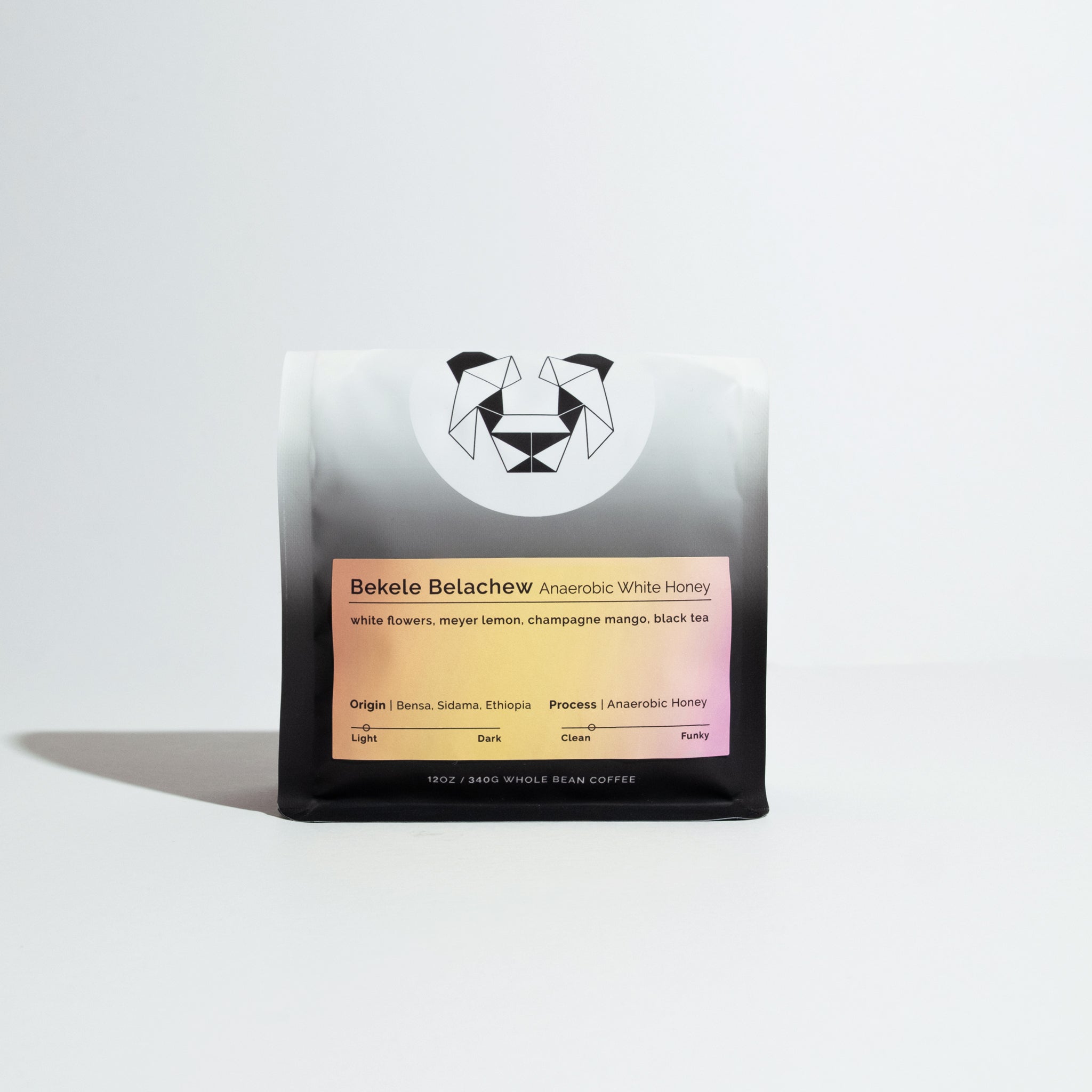 12 oz bag of Bekele Belachew Anaerobic White Honey coffee, featuring flavor notes and origin details, with a geometric animal logo on a gradient bag.