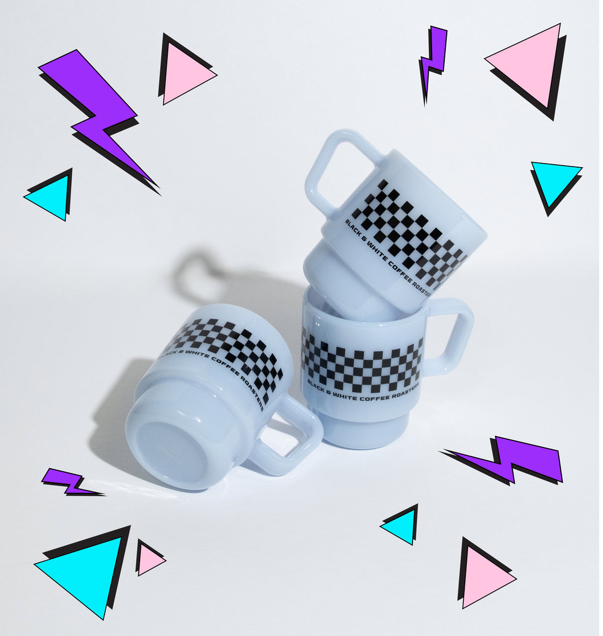 Three light blue ceramic mugs with black and white checkered bands, arranged on a clean white surface against a white background.