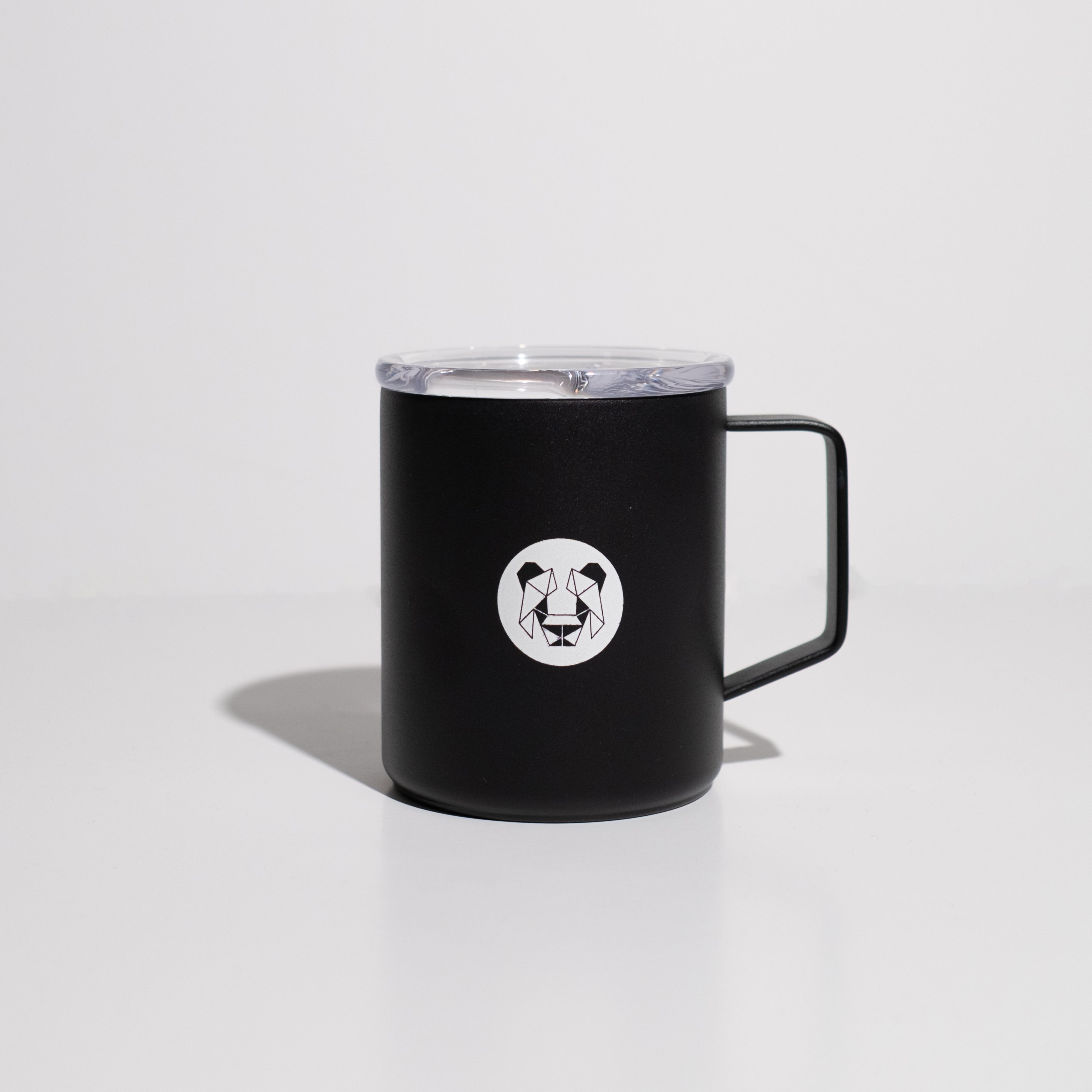 An enamel 12 ounce Camp cup that is black with white lettering that says, your favorite roaster favorite roaster on one side and a geometric panda on the other side. Cup is situated on white background