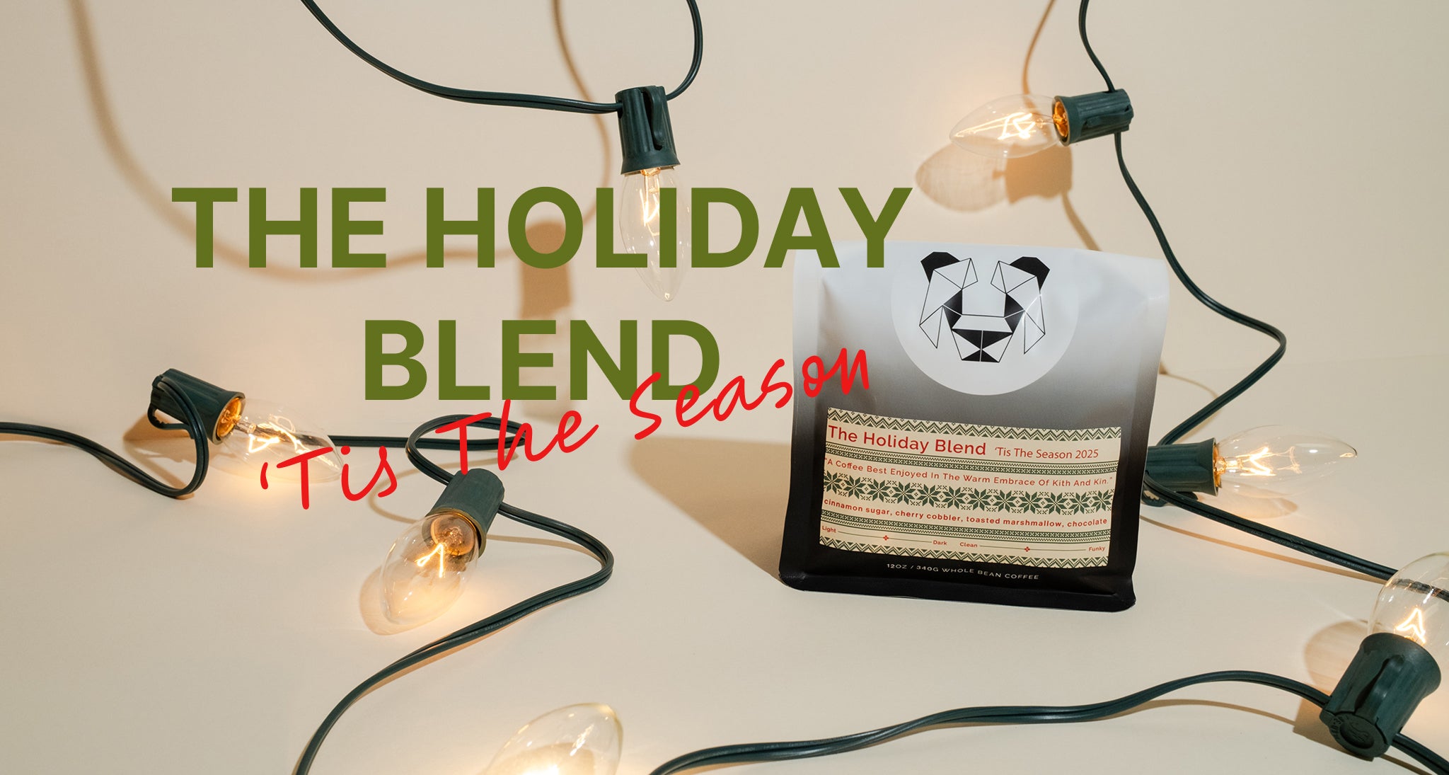Coffee bag labeled 'The Holiday Blend' with string lights on a light background