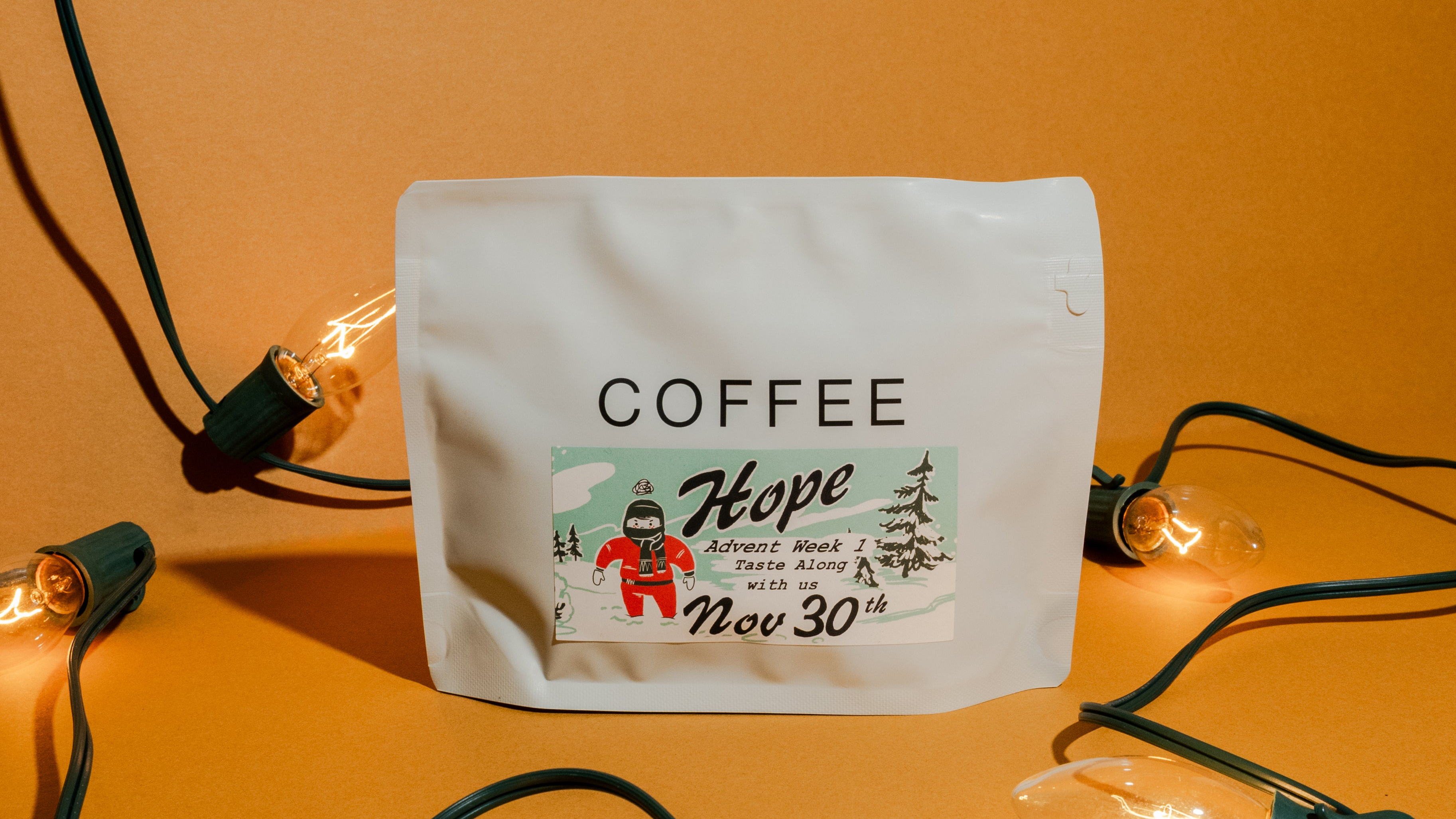 Coffee package with a festive label on an orange background