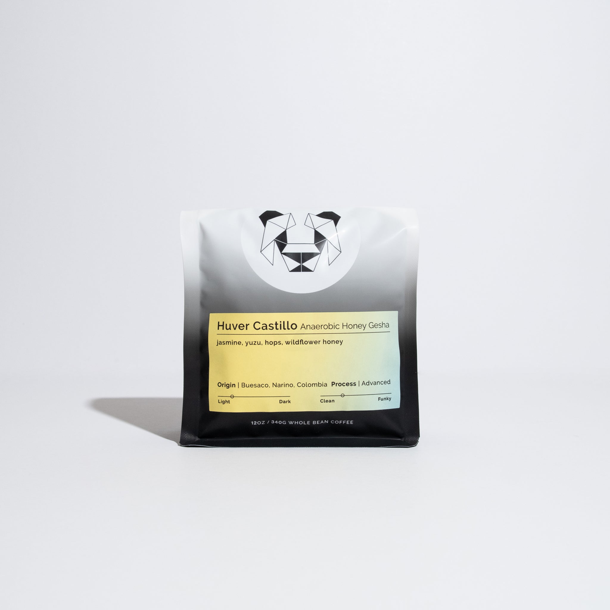 Huver Castillo Anaerobic Honey Gesha coffee pouch featuring tasting notes and origin details, with a geometric animal logo on gradient packaging.