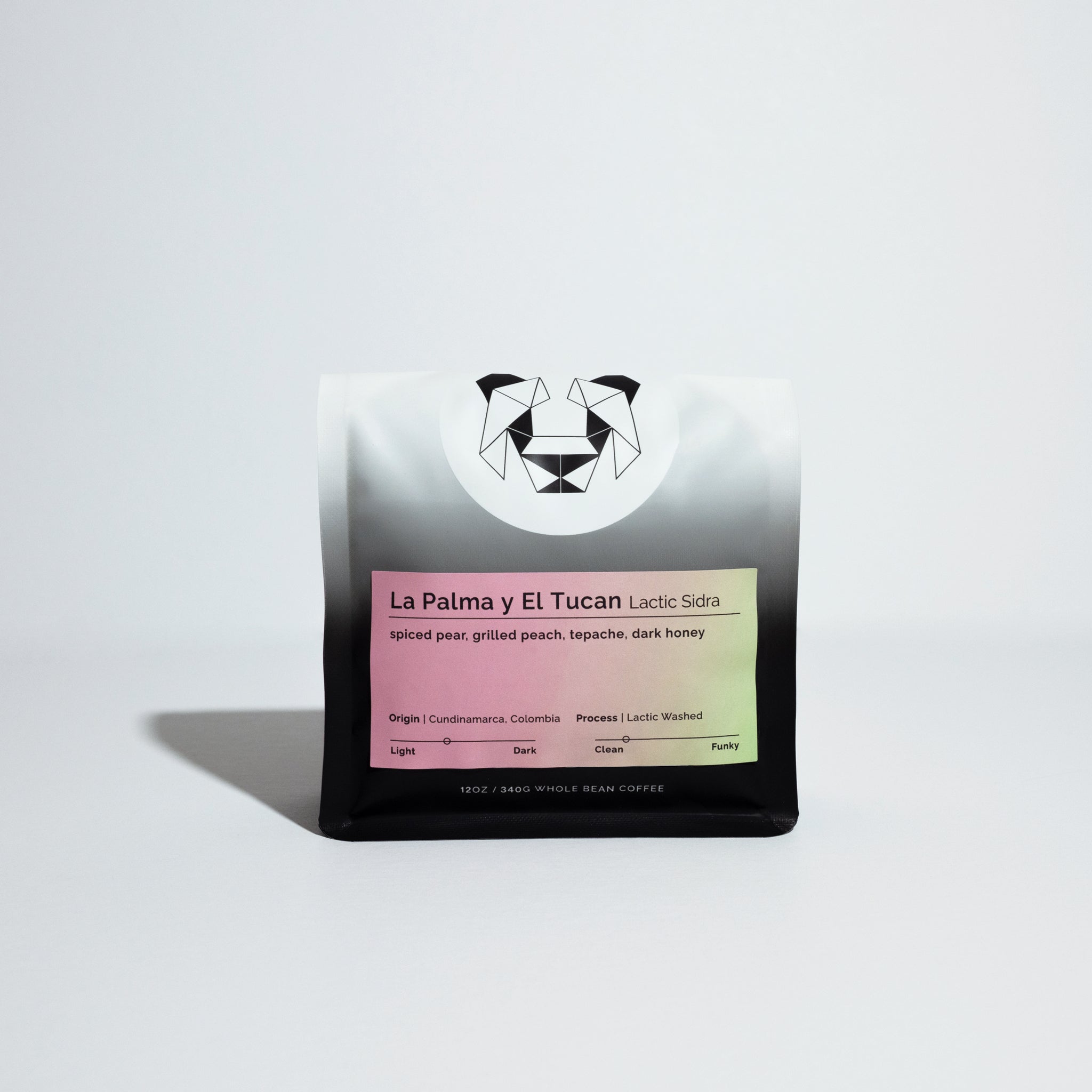 La Palma y El Tucan Lactic Sidra coffee pouch with geometric panda logo and pastel label detailing origin, tasting notes, and lactic washed process.