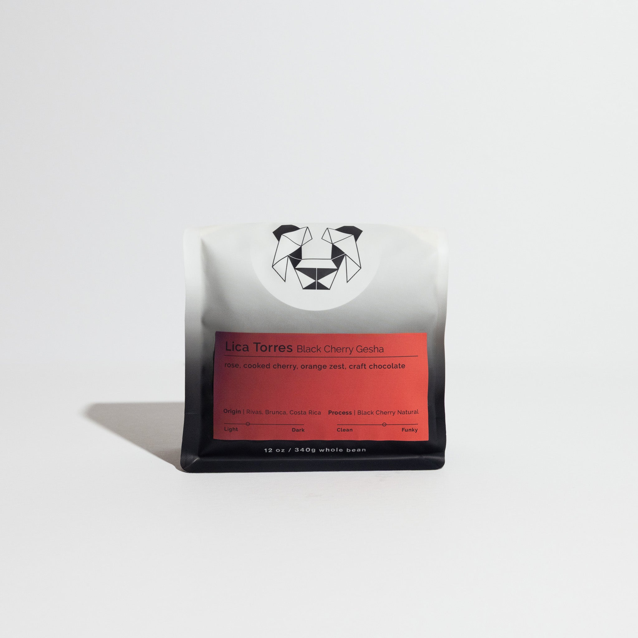 Lica Torres Black Cherry Gesha coffee, 12 oz bag, features a black-and-white pouch with geometric logo, red label detailing tasting notes and Costa Rican origin.
