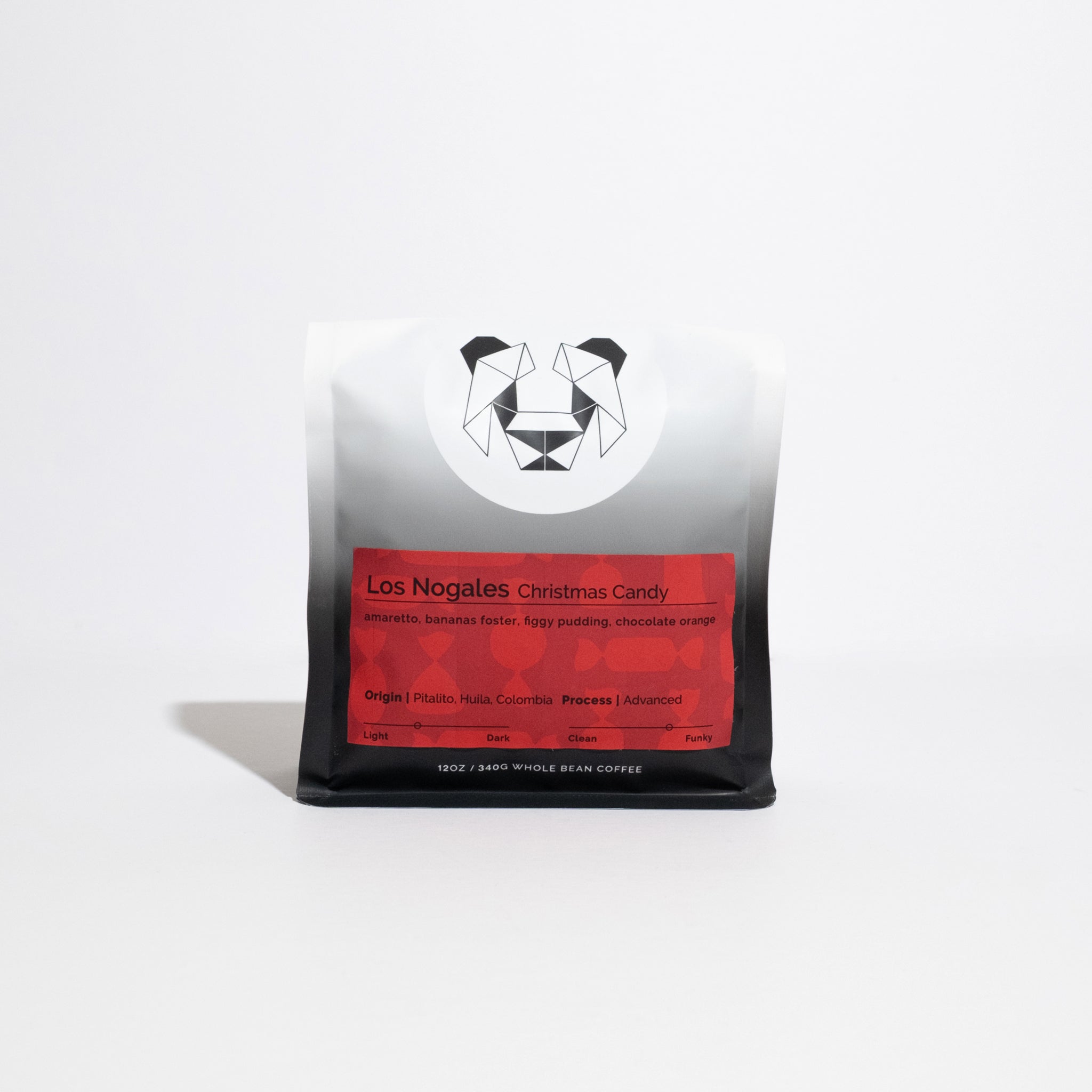 Bag of Los Nogales Christmas Candy whole-bean coffee, 12 oz, featuring tasting notes of amaretto and chocolate orange, sourced from Pitalito, Colombia.