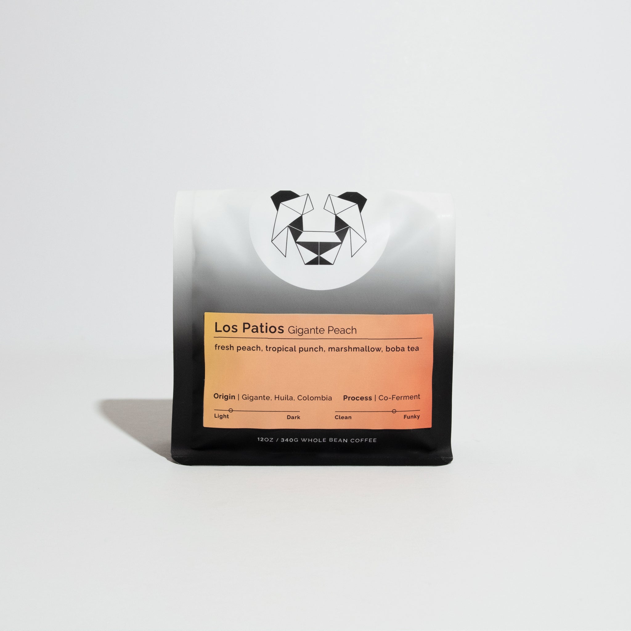 Los Patios - Gigante Peach coffee bag, featuring warm gradient label with tasting notes of peach, tropical punch, and marshmallow; origin: Huila, Colombia.