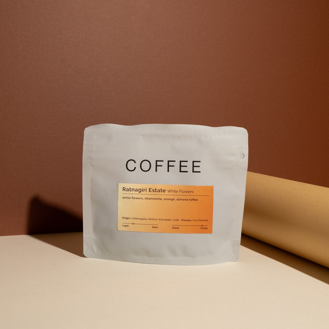 Ratnagiri Estate - White Flowers coffee, showcasing specialty beans processed with floral co-fermentation, emphasizing its unique origin and production techniques from India.