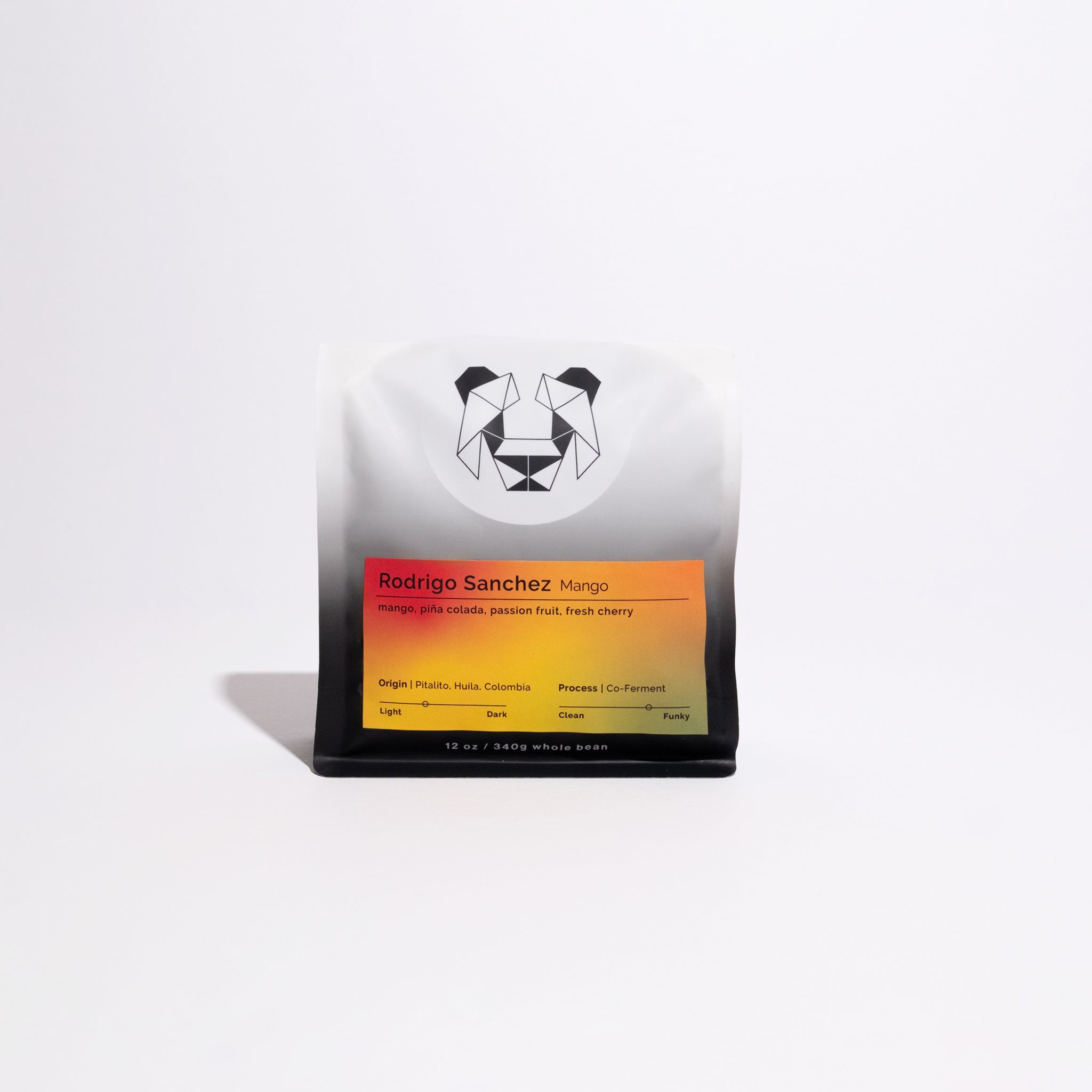 Rodrigo Sanchez Mango coffee bag, 12 oz whole-bean, features a geometric logo, gradient label with origin, tasting notes, and co-ferment process highlights.
