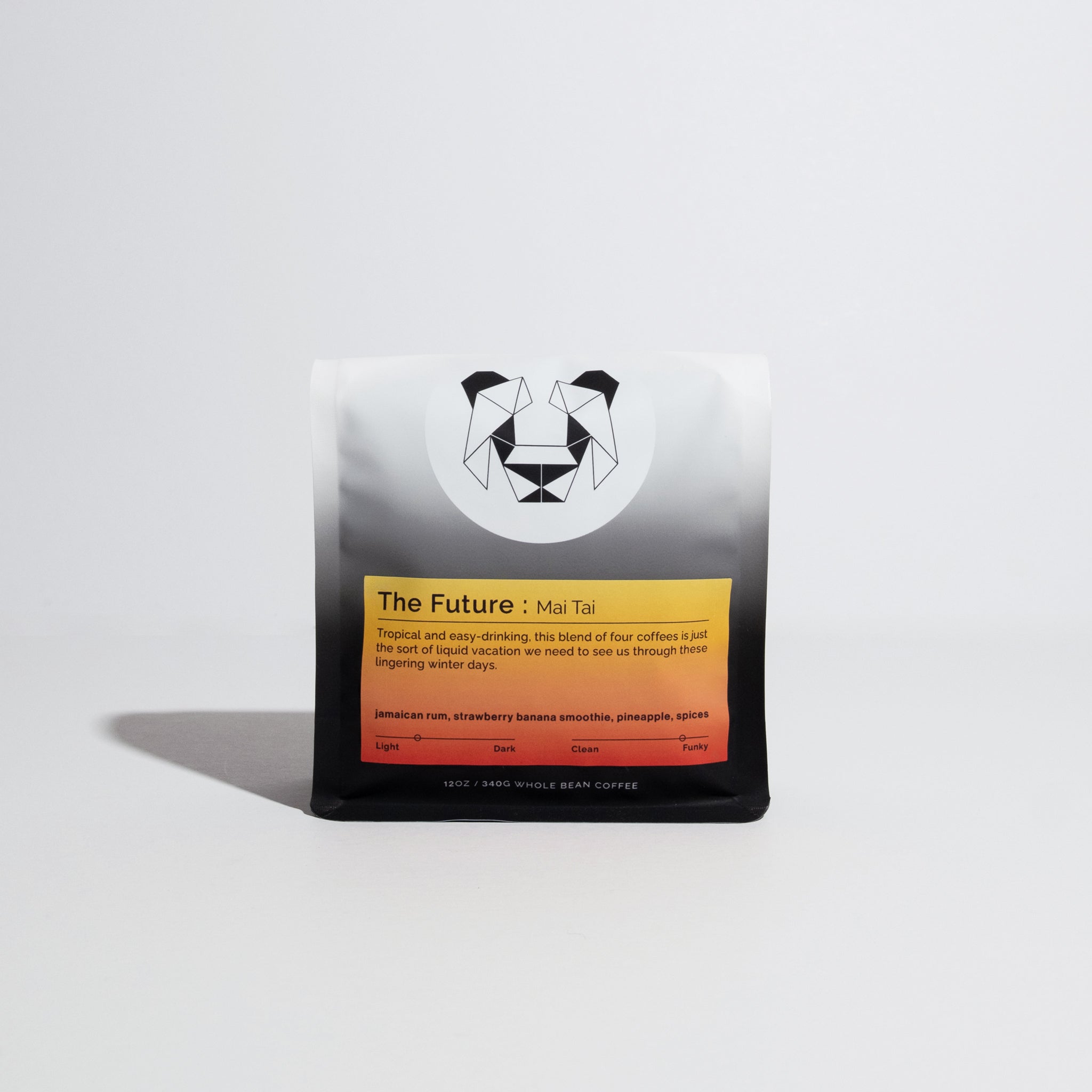 Bag of whole-bean coffee, The Future: Mai Tai, with geometric panda logo; notes of Jamaican rum, strawberry banana, pineapple, and spices. Tropical, dark, funky blend.